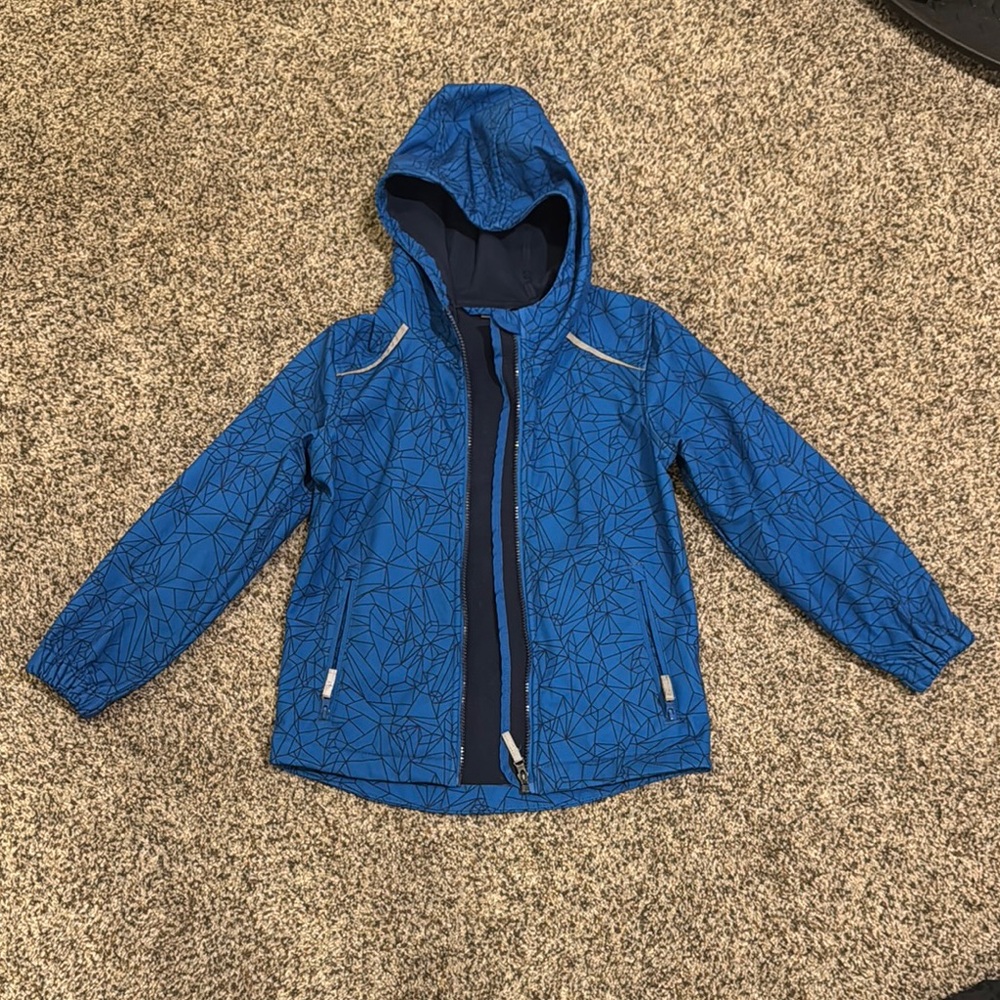 Blue Hooded Rain Jacket with Geometric Pattern